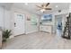 Inviting living room featuring luxury vinyl plank flooring and a decorative cabinet at 1615 W Gadsen Blvd, Orlando, FL 32812