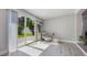 Bright seating area with sliding glass doors to the backyard, providing ample natural light at 1615 W Gadsen Blvd, Orlando, FL 32812