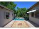 Charming backyard brick patio offering access to the house, garage and lush backyard at 1621 Sunnyside Dr, Maitland, FL 32751