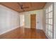 Bedroom featuring hardwood floors, ceiling fan, and shiplap walls at 1621 Sunnyside Dr, Maitland, FL 32751