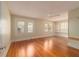 Bright bedroom features gleaming wood floors, built-in shelves, and ample natural light through shuttered windows at 1621 Sunnyside Dr, Maitland, FL 32751