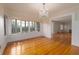 Dining room with hardwood floors, natural light, and traditional chandelier at 1621 Sunnyside Dr, Maitland, FL 32751