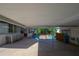 A view of the covered parking area between the house and backyard pool at 1621 Sunnyside Dr, Maitland, FL 32751