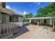 A side view of the home featuring covered parking and a peek at the backyard pool at 1621 Sunnyside Dr, Maitland, FL 32751