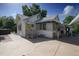 Exterior view of the home with its covered parking area, porch and well-maintained yard at 1621 Sunnyside Dr, Maitland, FL 32751