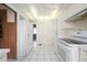 Efficient white kitchen features ample cabinetry, modern appliances, and bright, natural light at 1621 Sunnyside Dr, Maitland, FL 32751