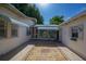 Cozy brick patio area perfect for outdoor entertaining, features a screened in porch at 1621 Sunnyside Dr, Maitland, FL 32751