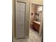 Bright bathroom featuring a single sink vanity, tile flooring, and decorative accents at 1637 Mistflower Ln, Winter Garden, FL 34787