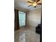 Bedroom with neutral walls, tile flooring and a ceiling fan at 1637 Mistflower Ln, Winter Garden, FL 34787