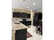 Kitchen featuring granite countertops, stainless steel appliances, and tile flooring at 1637 Mistflower Ln, Winter Garden, FL 34787