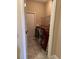 Functional laundry room featuring a washer and dryer, tiled floor, and shelving at 1637 Mistflower Ln, Winter Garden, FL 34787
