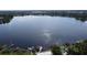 Expansive lake view from an aerial perspective, highlighting the dock and serene water access at 1653 Cheyenne Trl, Maitland, FL 32751