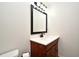 Bathroom with a dark wood vanity, white countertop, and modern fixtures at 1653 Cheyenne Trl, Maitland, FL 32751