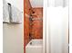 Bathroom featuring a tiled shower with a white shower curtain and chrome fixtures at 1653 Cheyenne Trl, Maitland, FL 32751