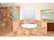 Bathroom with tiled shower and separate soaking tub with granite surround at 1653 Cheyenne Trl, Maitland, FL 32751