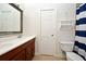 Bright bathroom with a double sink vanity, toilet and bathtub with shower, offers functionality and style at 1653 Cheyenne Trl, Maitland, FL 32751