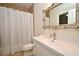 Bathroom with a classic vanity, ornate mirror, and a shower with a curtain at 1653 Cheyenne Trl, Maitland, FL 32751