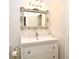 Clean bathroom with a vanity, framed mirror, and ample lighting at 1653 Cheyenne Trl, Maitland, FL 32751