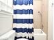Neat bathroom with blue and white shower curtain, showcasing a simple and clean design at 1653 Cheyenne Trl, Maitland, FL 32751