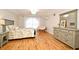 Spacious bedroom with hardwood floors, a chandelier and ample natural light at 1653 Cheyenne Trl, Maitland, FL 32751