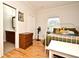 Bedroom featuring hardwood floors, white trim, and adjacent bathroom access at 1653 Cheyenne Trl, Maitland, FL 32751