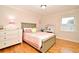 Cozy bedroom featuring hardwood floors, a comfortable bed, and lots of natural light at 1653 Cheyenne Trl, Maitland, FL 32751