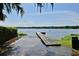 Scenic view of the lake and private dock access, creating an ideal spot for fishing or relaxing by the water at 1653 Cheyenne Trl, Maitland, FL 32751