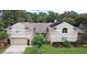 Charming two-story home featuring a well-manicured lawn and attached two car garage at 1653 Cheyenne Trl, Maitland, FL 32751