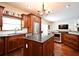 Functional kitchen with modern appliances, granite countertops, and a center island for meal preparation at 1653 Cheyenne Trl, Maitland, FL 32751