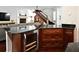 Open-concept living area with fireplace, wine storage, and access to the staircase for seamless entertaining at 1653 Cheyenne Trl, Maitland, FL 32751