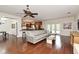 Bright living room with hardwood floors, open to the kitchen, with view of the outdoor area at 1653 Cheyenne Trl, Maitland, FL 32751