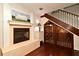 Living room featuring a fireplace, wine cellar, and staircase at 1653 Cheyenne Trl, Maitland, FL 32751