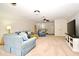 Expansive living room with comfortable seating, a television, and staircase access at 1653 Cheyenne Trl, Maitland, FL 32751