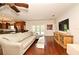 Open-concept living room with hardwood floors, a large sectional, and natural light at 1653 Cheyenne Trl, Maitland, FL 32751