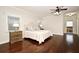 Main bedroom boasts hardwood floors, ceiling fan, and ensuite bathroom at 1653 Cheyenne Trl, Maitland, FL 32751