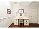 Well-lit office with white wainscoting and built-in desk and storage space at 1653 Cheyenne Trl, Maitland, FL 32751