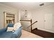 Cozy nook with comfortable seating, a bookcase, and a staircase at 1653 Cheyenne Trl, Maitland, FL 32751