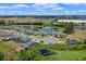 Community aerial view highlighting water features, neighborhood layout, and surrounding landscaping at 17319 Million Lakes Ct, Clermont, FL 34714