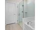 Bathroom showcasing a walk-in shower with glass door at 17319 Million Lakes Ct, Clermont, FL 34714