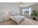Serene bedroom with minimalist decor, plush bedding, and soft natural light, creating a relaxing atmosphere at 17319 Million Lakes Ct, Clermont, FL 34714