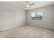 Cozy bedroom with ceiling fan, window overlooking the pond at 17319 Million Lakes Ct, Clermont, FL 34714