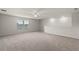 Spacious bonus room with neutral carpet, ceiling fan and two windows at 17319 Million Lakes Ct, Clermont, FL 34714