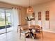 Cozy dining area with stylish lighting and easy access to outdoor patio at 17319 Million Lakes Ct, Clermont, FL 34714