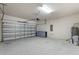 Spacious garage with an automatic door and cinder block walls, ready for vehicles or storage at 17319 Million Lakes Ct, Clermont, FL 34714