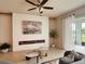 Bright living room featuring stylish decor and a cozy seating area with outdoor views at 17319 Million Lakes Ct, Clermont, FL 34714