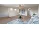 Upstairs loft area featuring neutral carpet, ample space, and stylish decor at 17319 Million Lakes Ct, Clermont, FL 34714