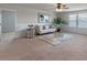Bright upstairs loft with a cozy seating area and large windows with peaceful view outside at 17319 Million Lakes Ct, Clermont, FL 34714
