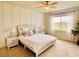 Serene main bedroom featuring soft natural light and tranquil views of the outdoors at 17319 Million Lakes Ct, Clermont, FL 34714