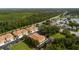 Aerial view of a townhouse complex near a lake, showing community layout and proximity to amenities at 2011 Crestdale Ln, Lake Mary, FL 32746