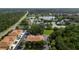 Aerial view of townhouses near a lake, emphasizing the community's location and scenic surroundings at 2011 Crestdale Ln, Lake Mary, FL 32746